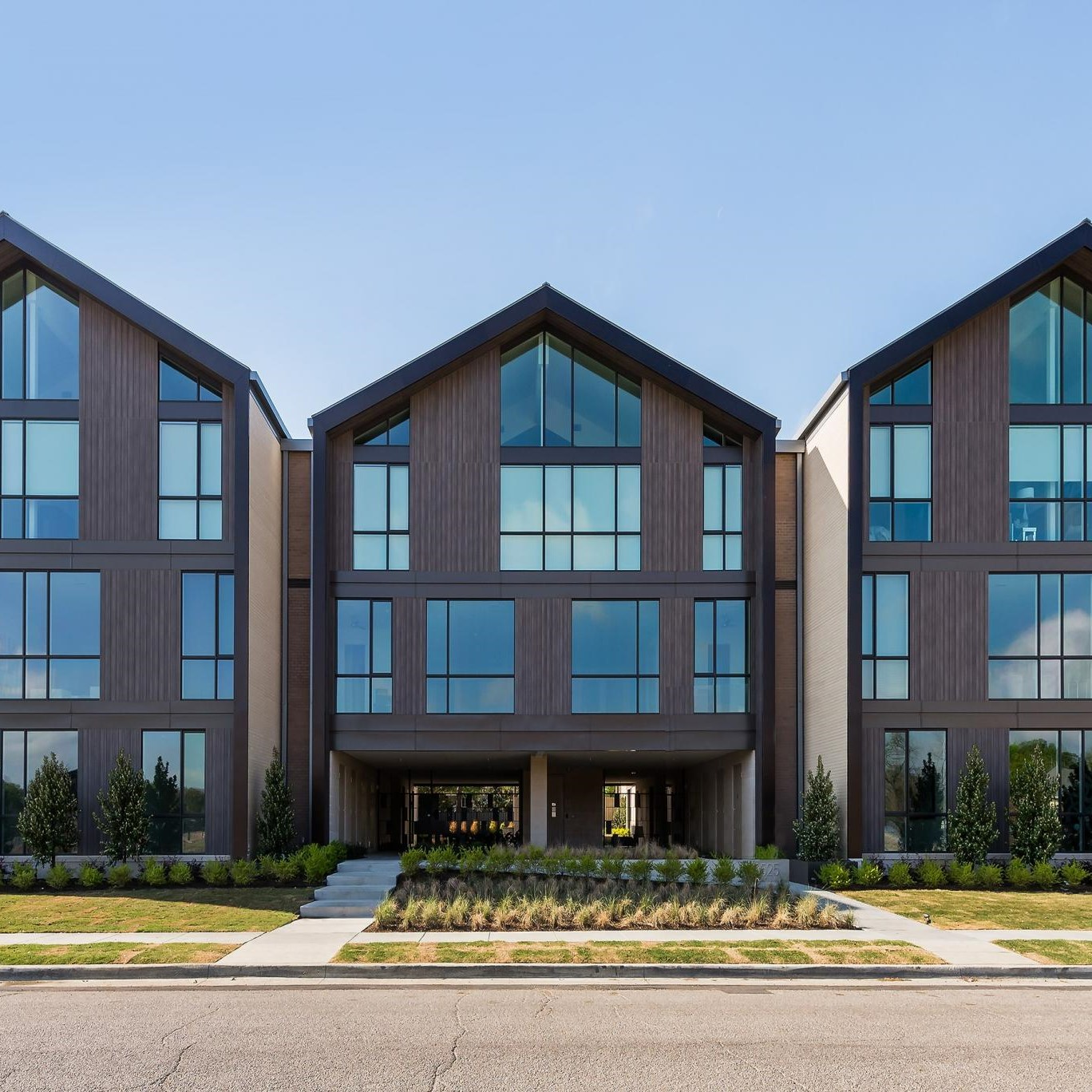 a modern apartment building with wood facade